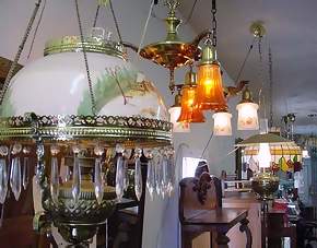 Antique lighting from the turn of the century ( the 20th century).  Hanging, table, wall and floor lights.