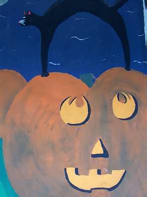 cat on pumpkin
